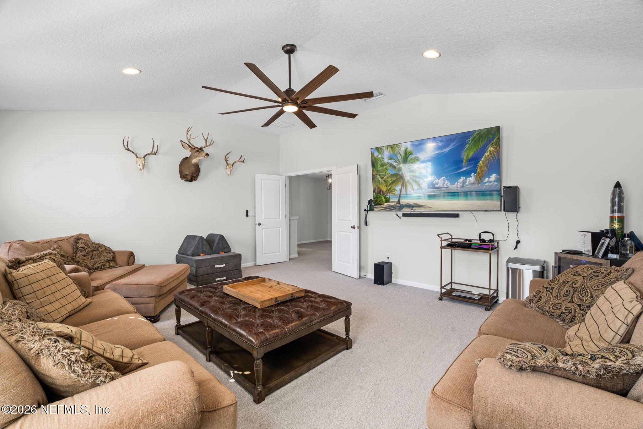 623 Ivory Palm Road Orange Park, FL 32073 - Photo 29 of 73 a living room with furniture and a flat screen tv