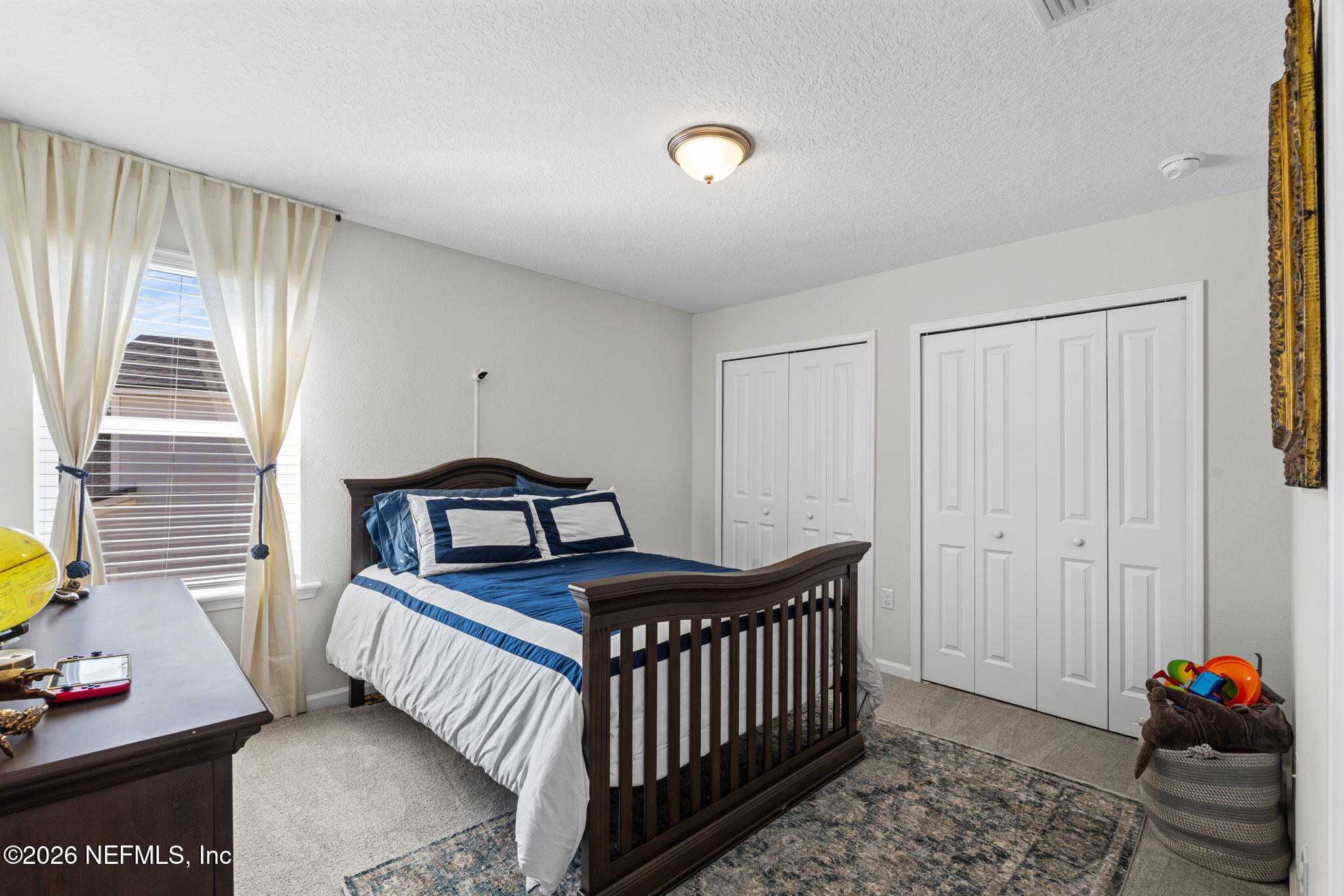 623 Ivory Palm Road Orange Park, FL 32073 - Photo 30 of 73 a bedroom with a bed and a window