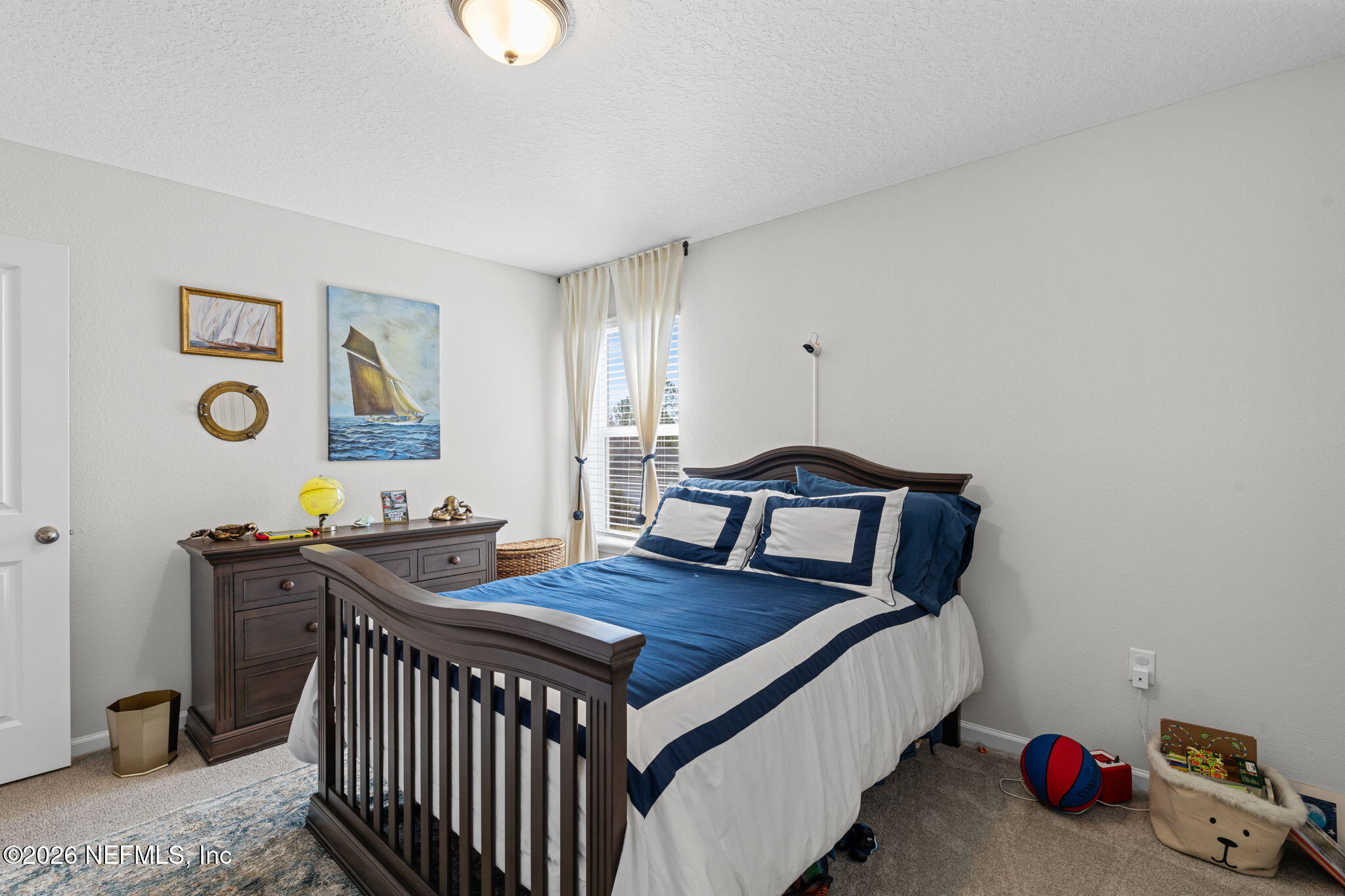 623 Ivory Palm Road Orange Park, FL 32073 - Photo 31 of 73 a bedroom with a bed and a table in it