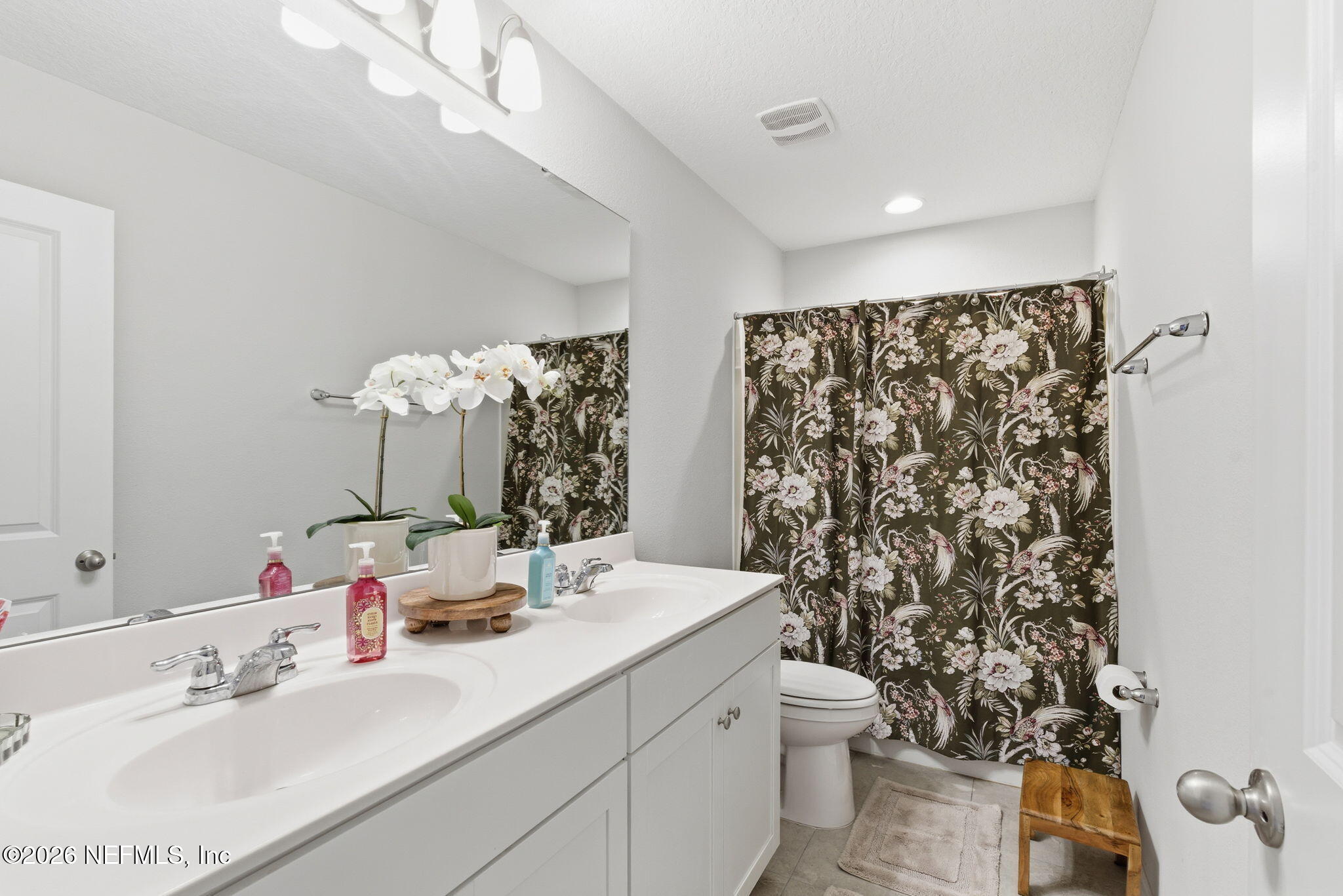 623 Ivory Palm Road Orange Park, FL 32073 - Photo 32 of 73 a bathroom with a double vanity sink toilet and a mirror