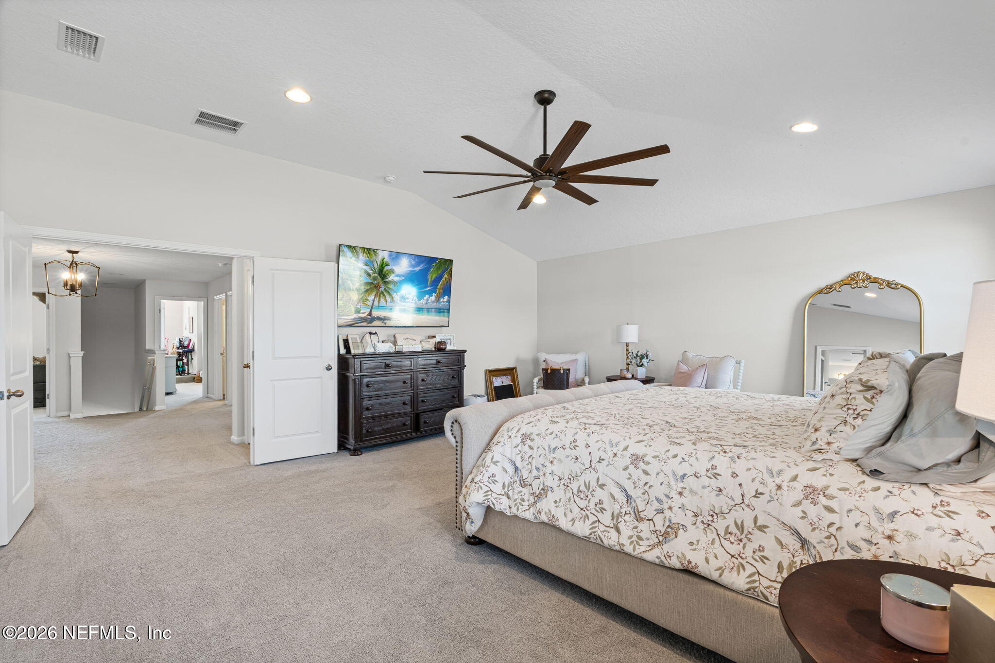 623 Ivory Palm Road Orange Park, FL 32073 - Photo 40 of 73 a bedroom with a bed and a chandelier