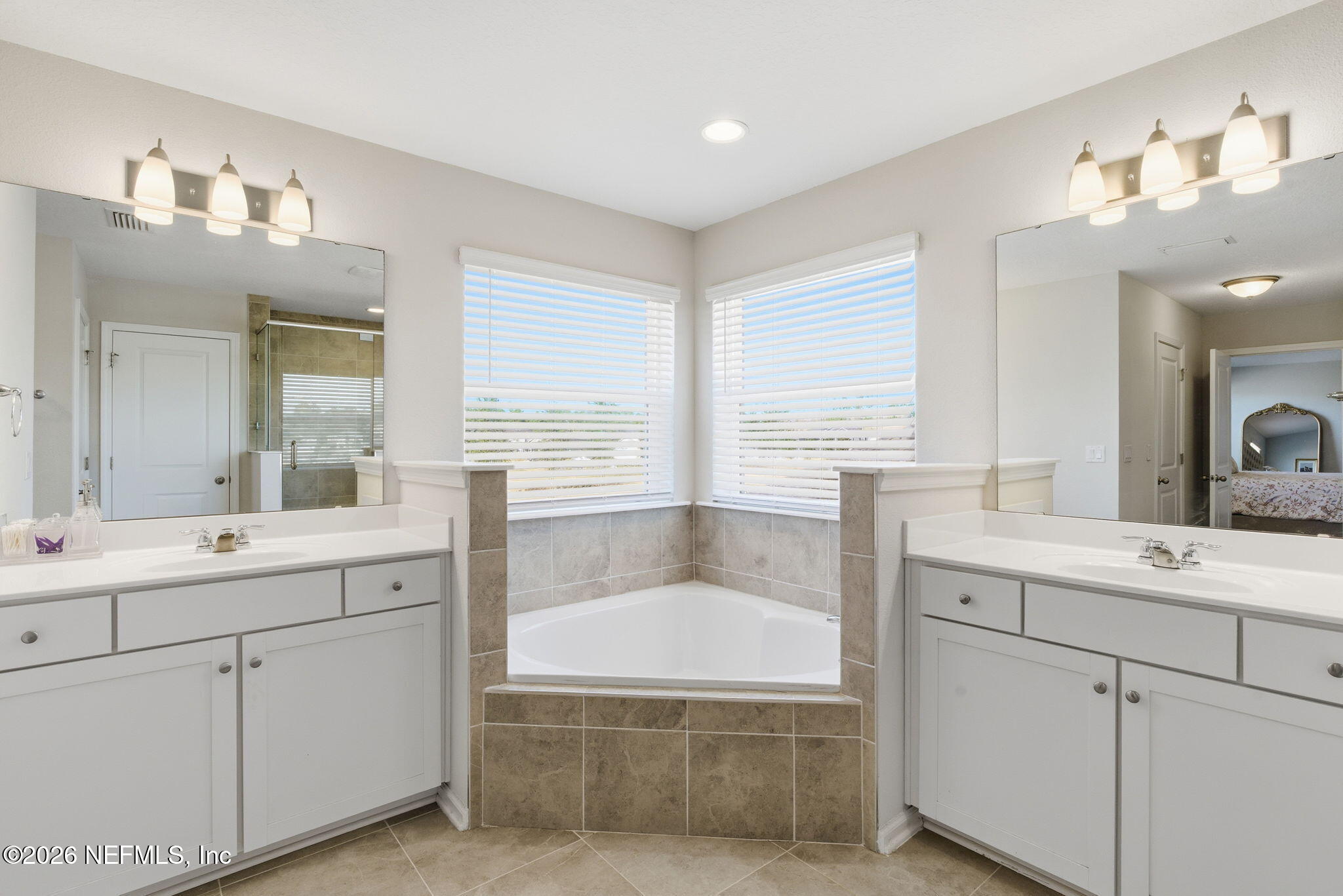 623 Ivory Palm Road Orange Park, FL 32073 - Photo 42 of 73 a spacious bathroom with a tub sink and mirror