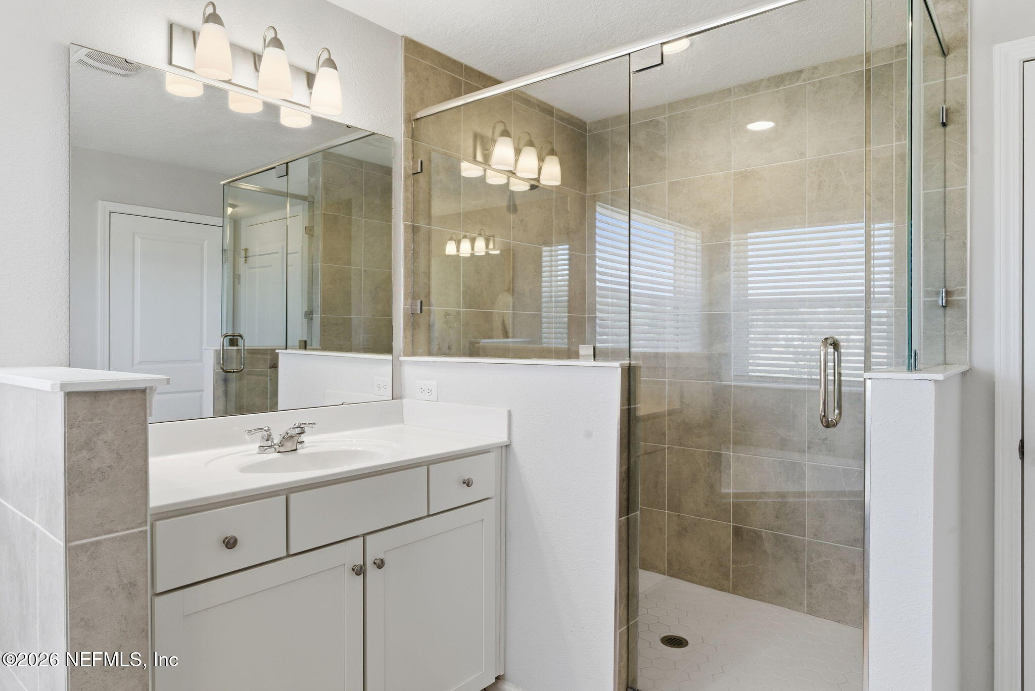 623 Ivory Palm Road Orange Park, FL 32073 - Photo 43 of 73 a bathroom with a sink shower and a mirror