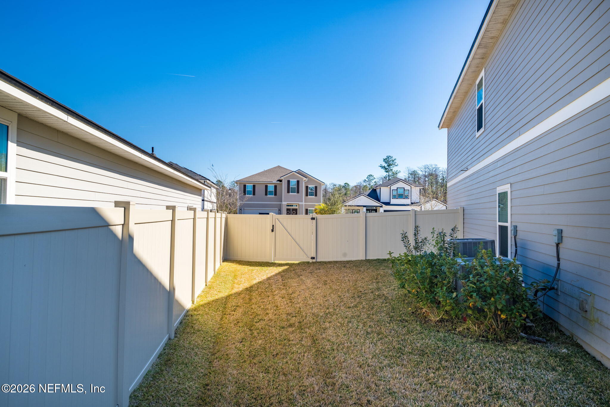 623 Ivory Palm Road Orange Park, FL 32073 - Photo 47 of 73 a view of a house with a small yard and wooden fence
