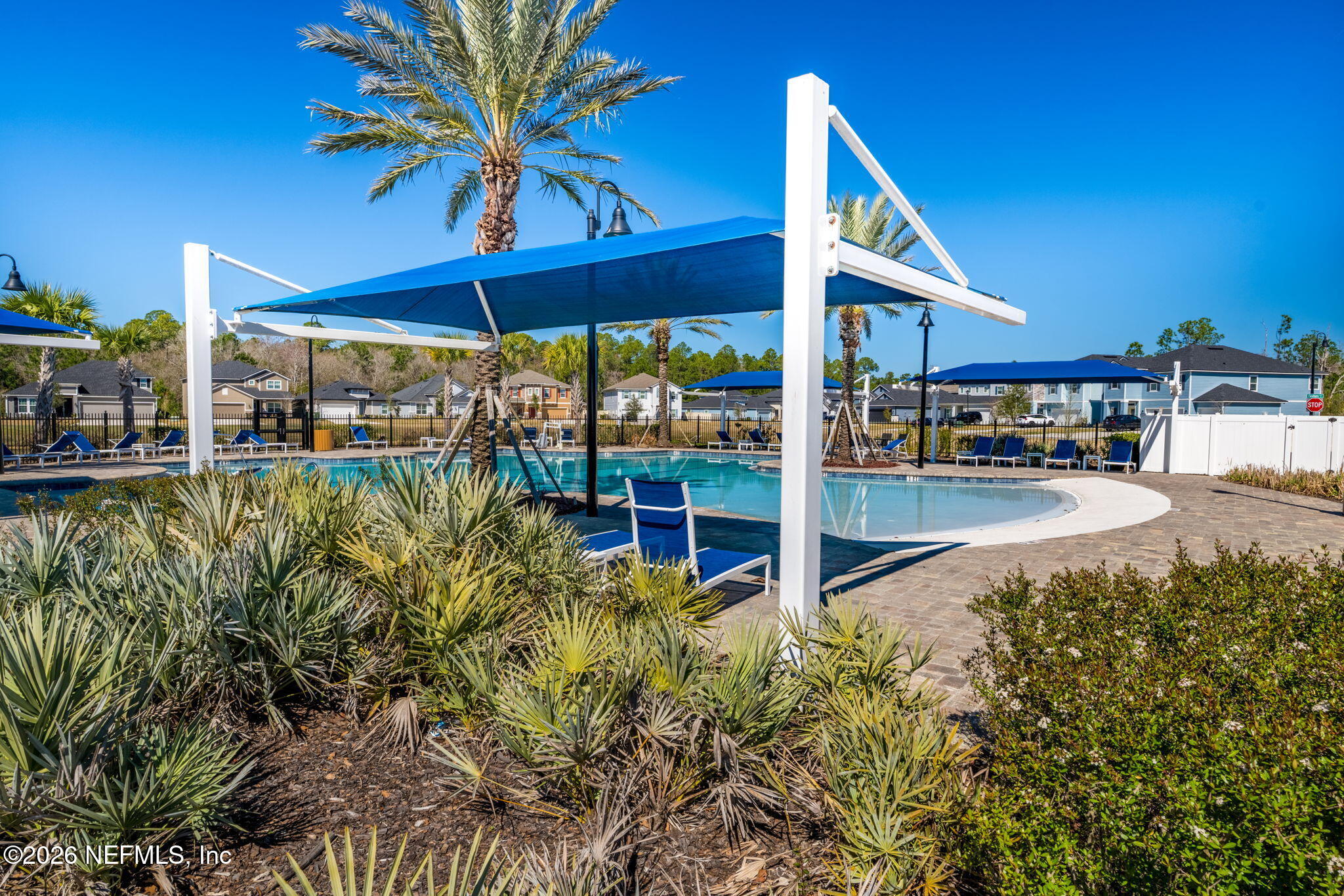 623 Ivory Palm Road Orange Park, FL 32073 - Photo 59 of 73 a view of a patio with table and chairs under an umbrella