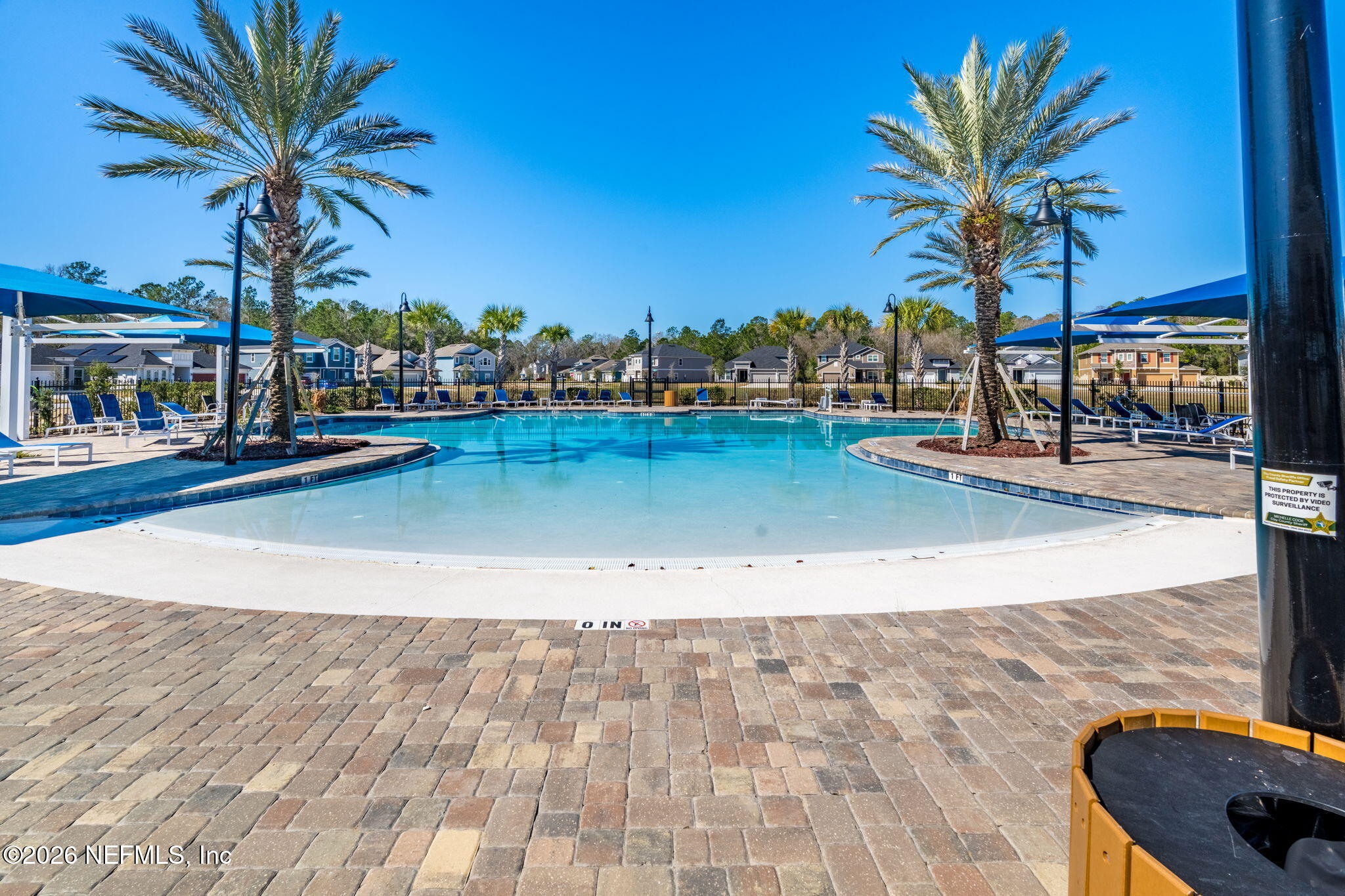 623 Ivory Palm Road Orange Park, FL 32073 - Photo 60 of 73 a view of a swimming pool with a table and chairs
