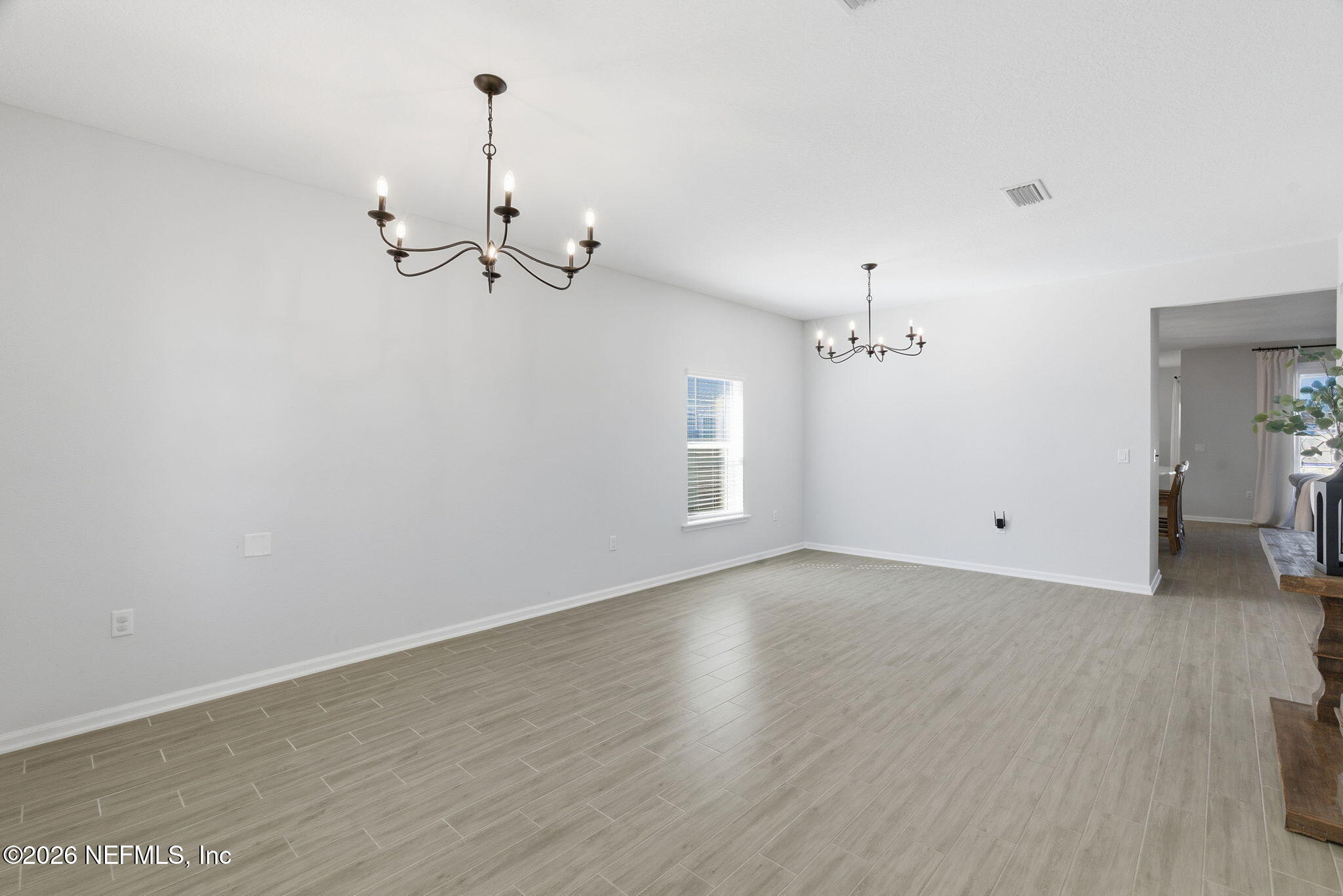 623 Ivory Palm Road Orange Park, FL 32073 - Photo 6 of 73 a view of a room with wooden floor and ceiling fan