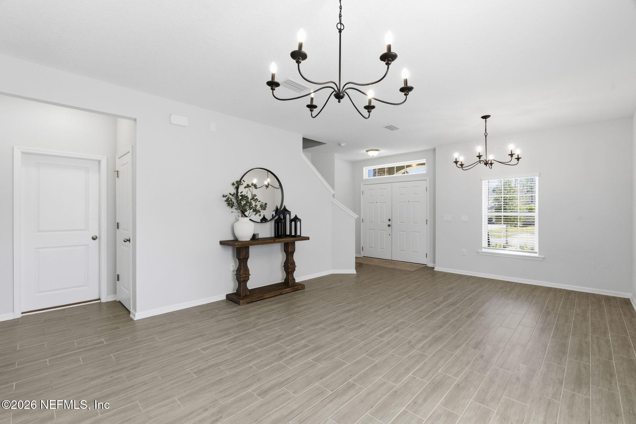 623 Ivory Palm Road Orange Park, FL 32073 - Photo 8 of 73 a view of a room with gym equipment and windows