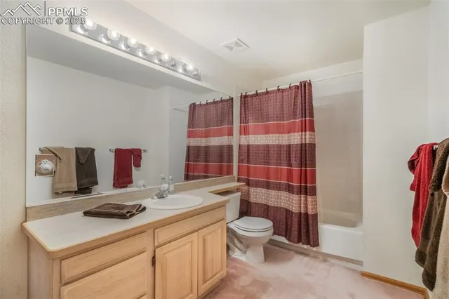 a bedroom with a bed and a lamp