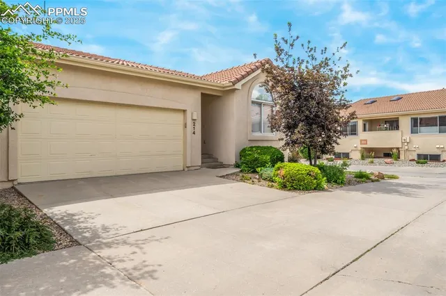 a aerial view of a house with a yard