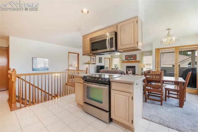 a kitchen with stainless steel appliances granite countertop a stove and a sink