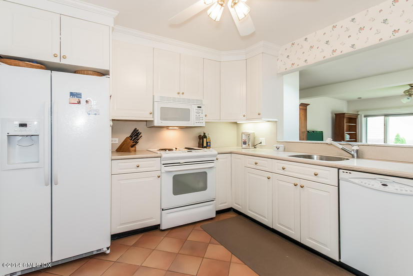 9 Linwood Avenue Riverside, CT 06878 - Photo 5 of 23 a kitchen with granite countertop white cabinets and white appliances