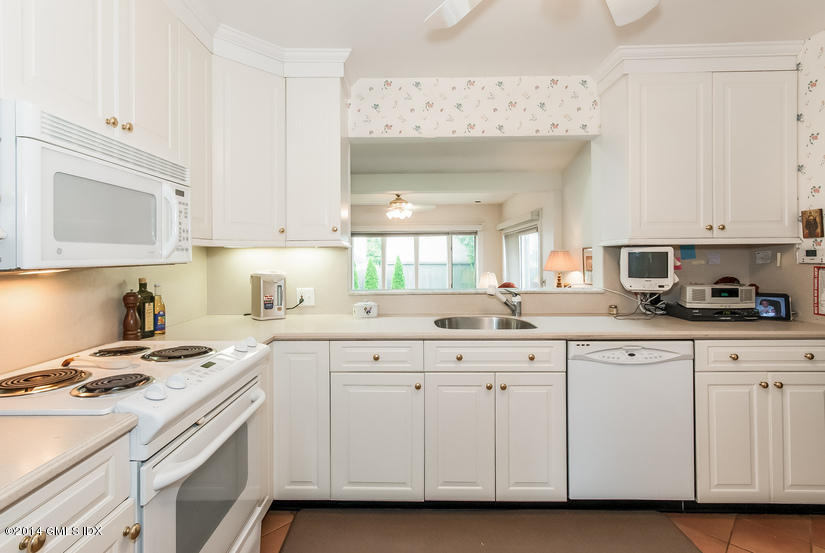 9 Linwood Avenue Riverside, CT 06878 - Photo 6 of 23 a kitchen with cabinets appliances a sink and a counter top space