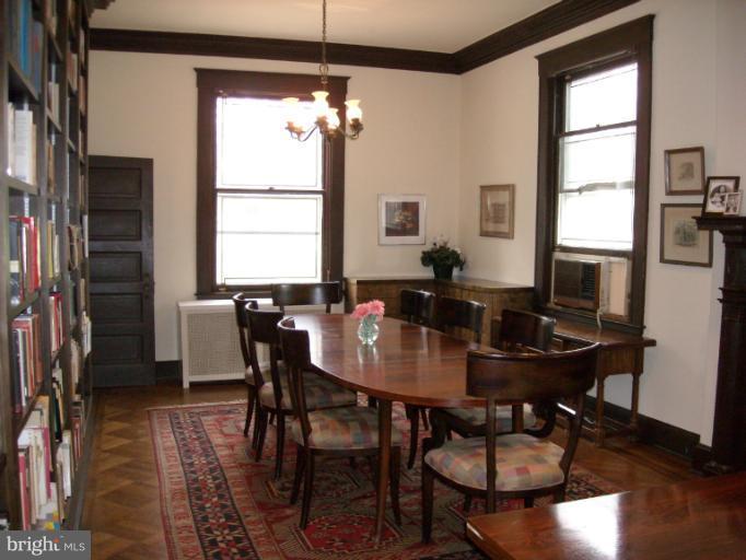 5504 Wexford Road Baltimore, MD 21209 - Photo 14 of 18 a view of a dining room with furniture window and wooden floor