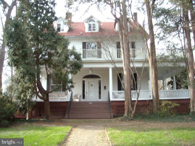 5504 Wexford Road Baltimore, MD 21209 - Photo 18 of 18 a front view of a house with a garden