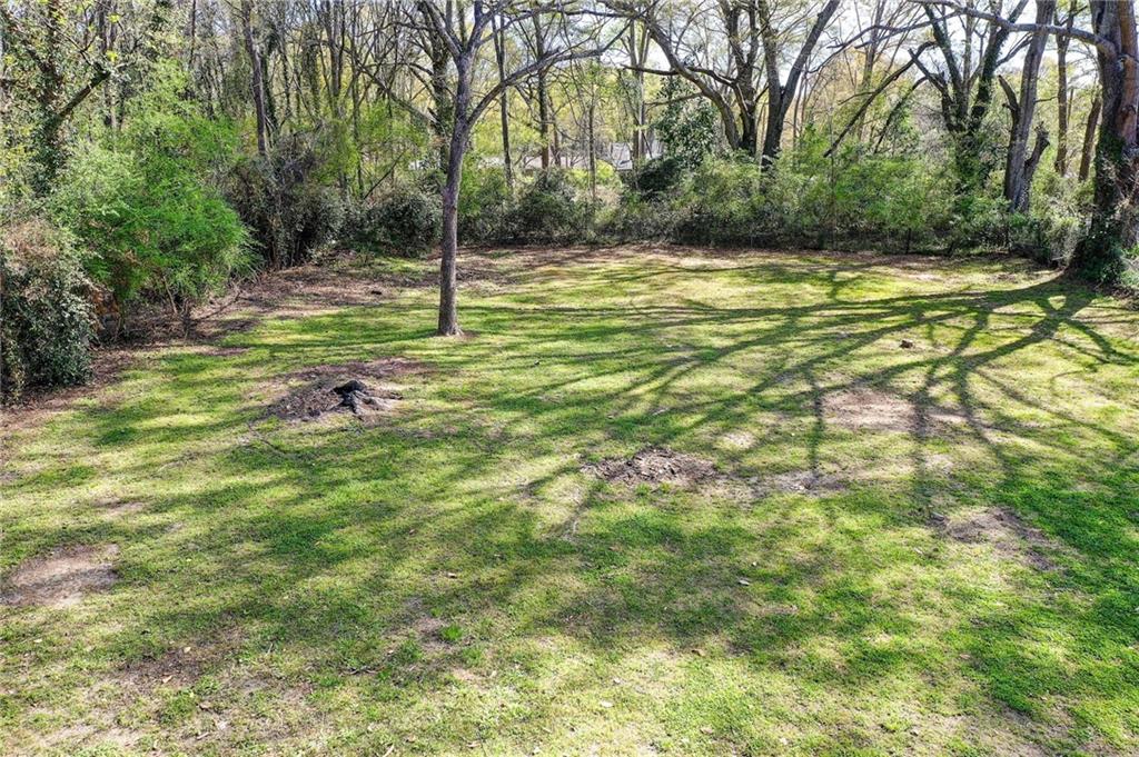 411 Ash Street Monroe, GA 30655 - Photo 12 of 36 a view of a house with a yard