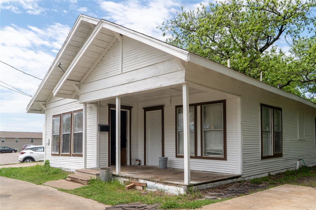 1810 Live Oak Street Commerce, TX 75428 - Photo 2 of 6 View of front of property featuring covered porch
