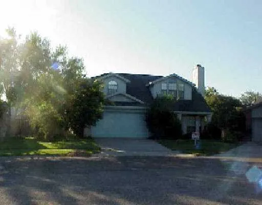 a view of a house with a street