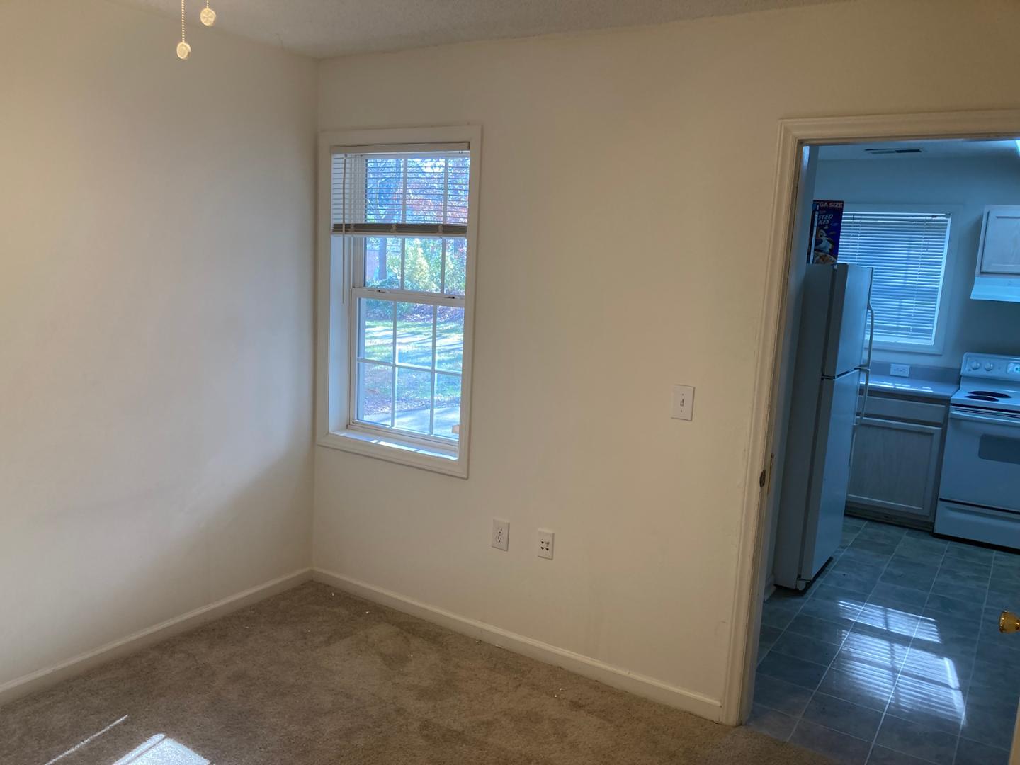3770 Pardue Woods Place, Unit 102A Raleigh, NC 27603 - Photo 5 of 13 a view of a kitchen that shows a sink and dishwasher in a room