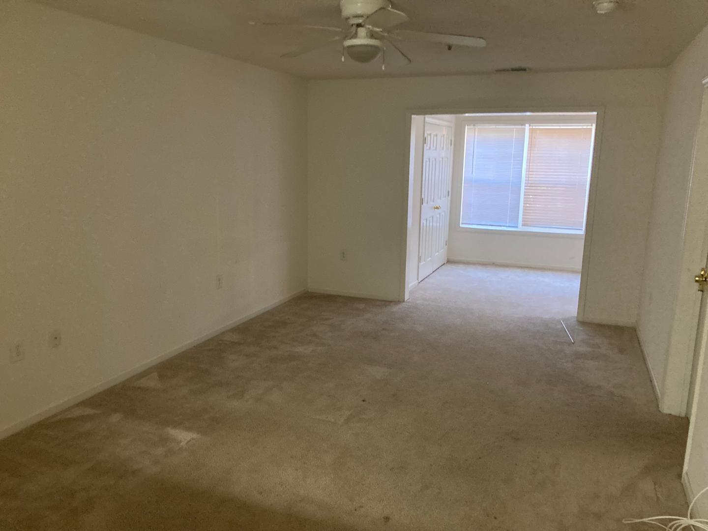 3770 Pardue Woods Place, Unit 102A Raleigh, NC 27603 - Photo 6 of 13 an empty room with a window