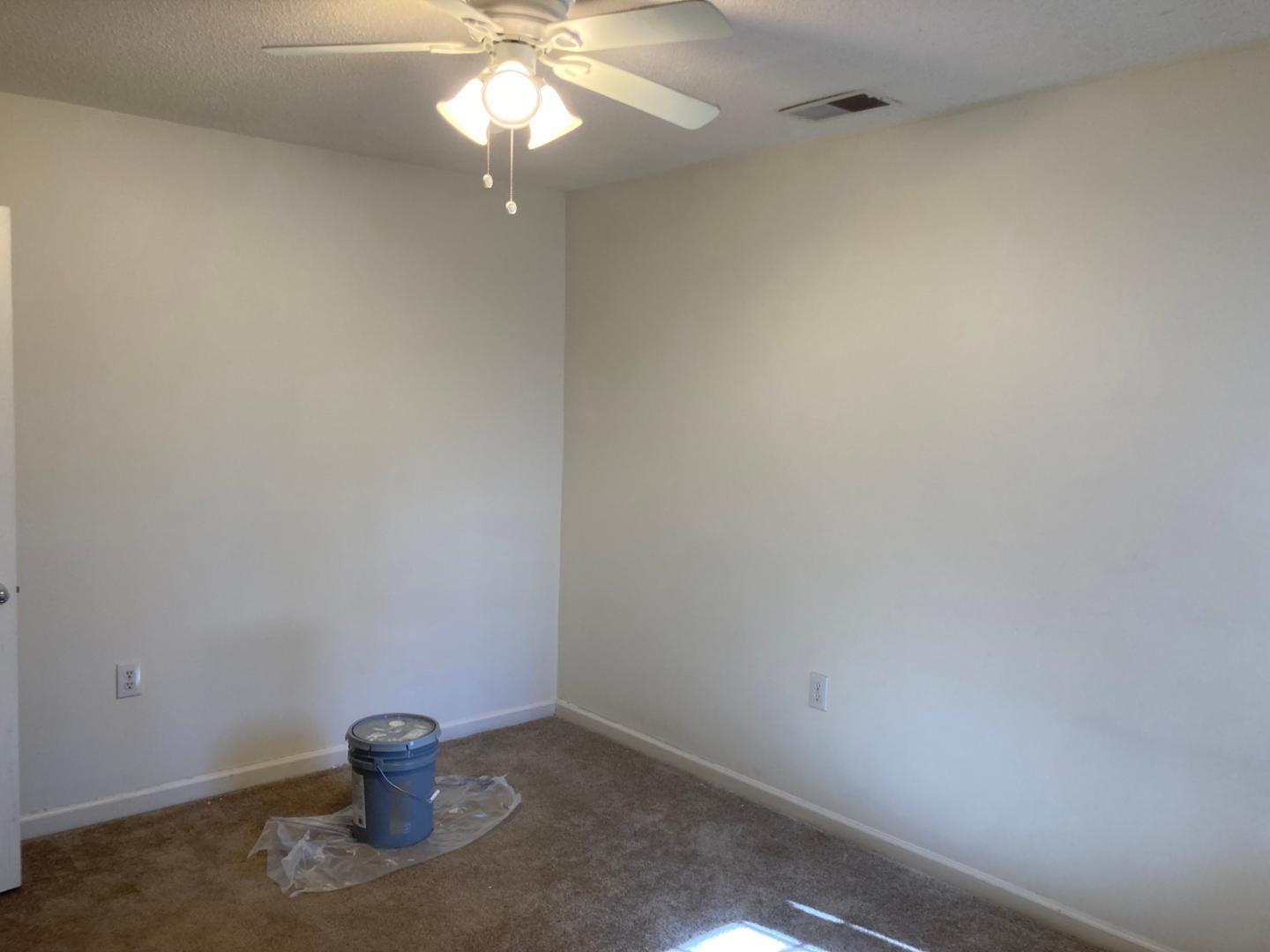 3770 Pardue Woods Place, Unit 102A Raleigh, NC 27603 - Photo 8 of 13 a view of an empty room and chandelier fan