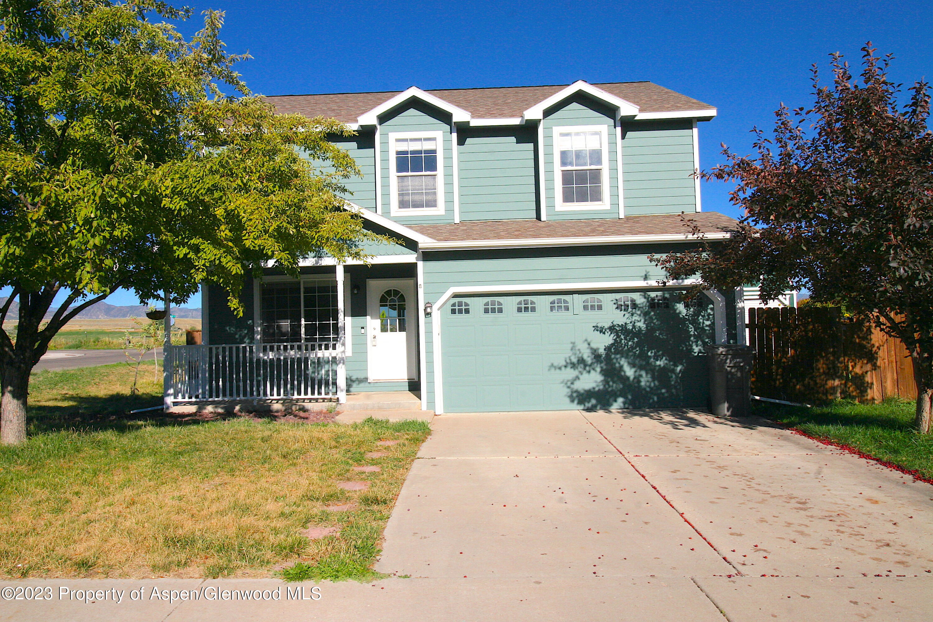 1391 East 17th Street Rifle, CO 81650 - Photo 1 of 36 a front view of a house with a yard