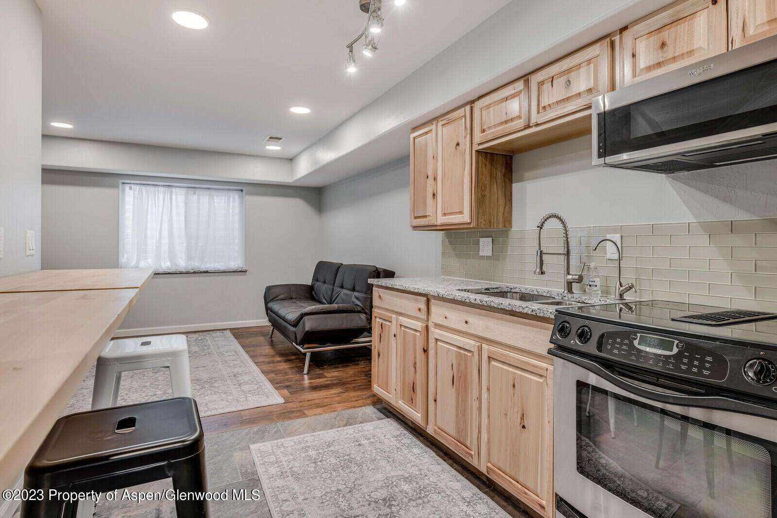 1391 East 17th Street Rifle, CO 81650 - Photo 26 of 36 a kitchen with a stove and a sink