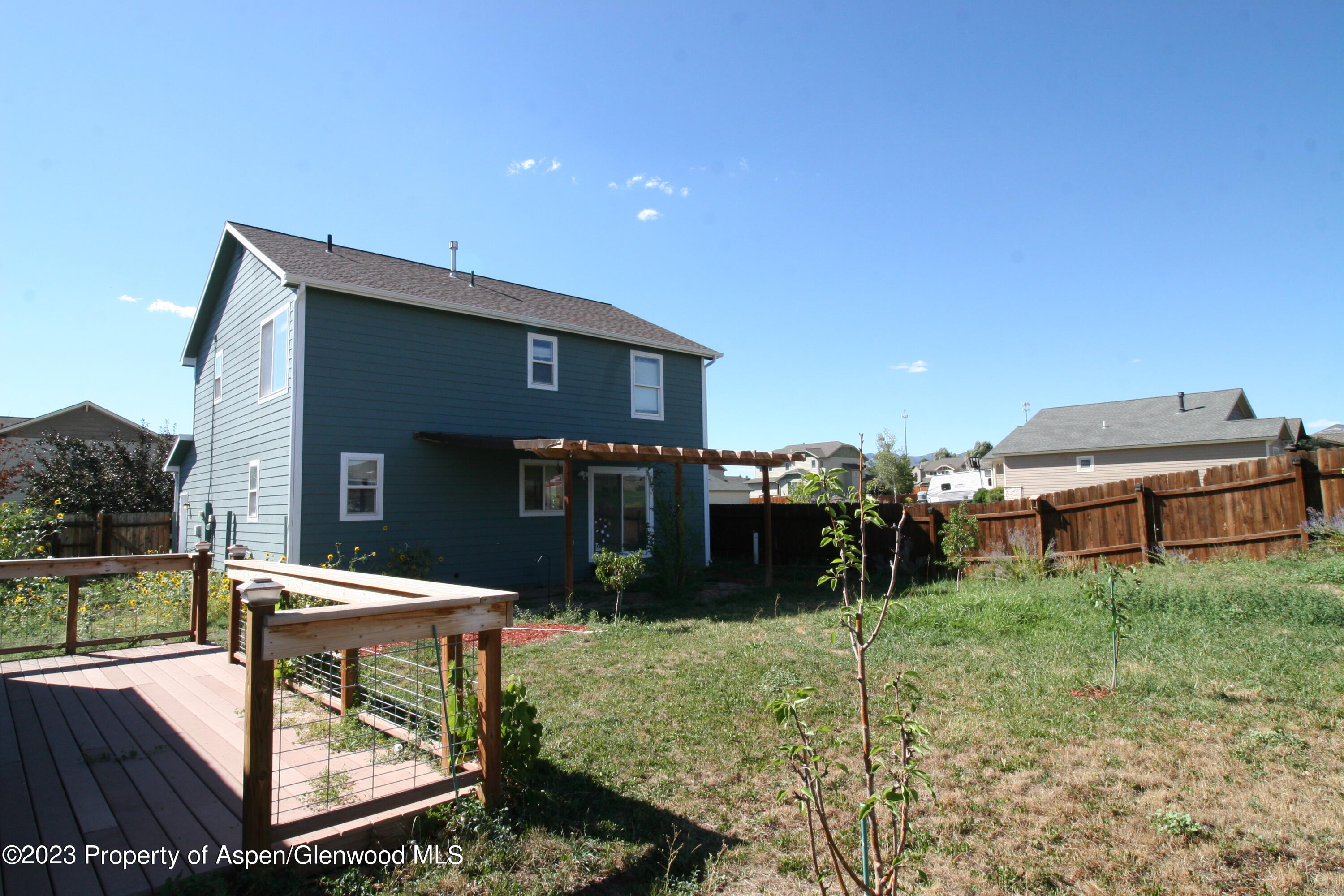 1391 East 17th Street Rifle, CO 81650 - Photo 34 of 36 a front view of a house with garden