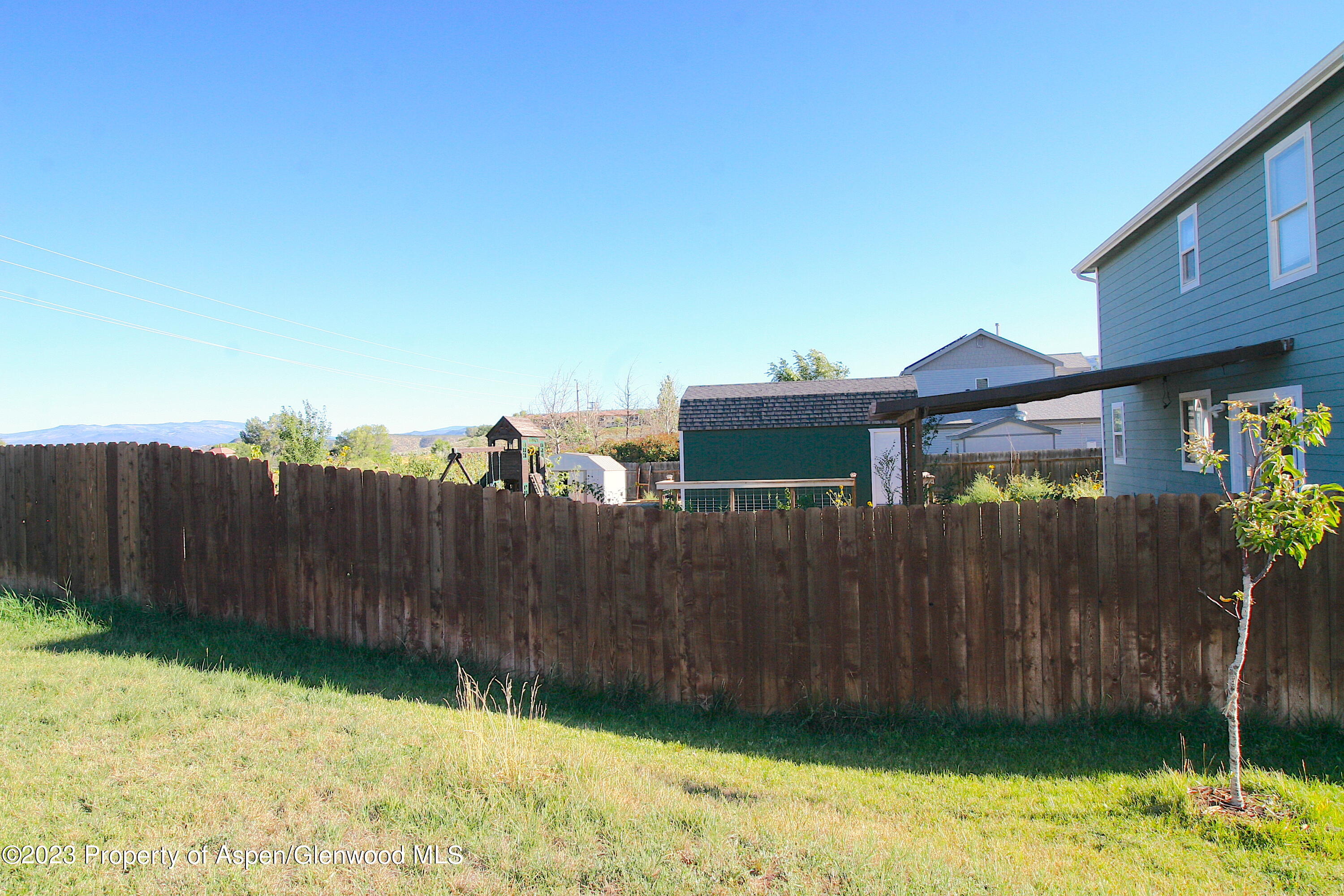 1391 East 17th Street Rifle, CO 81650 - Photo 36 of 36 a view of a backyard with wooden fence