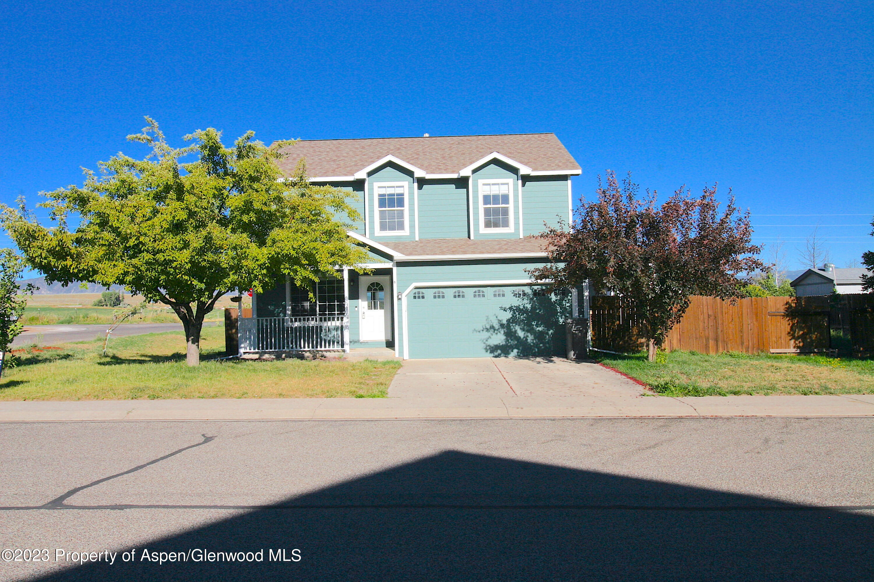 1391 East 17th Street Rifle, CO 81650 - Photo 4 of 36 a front view of a house with a yard