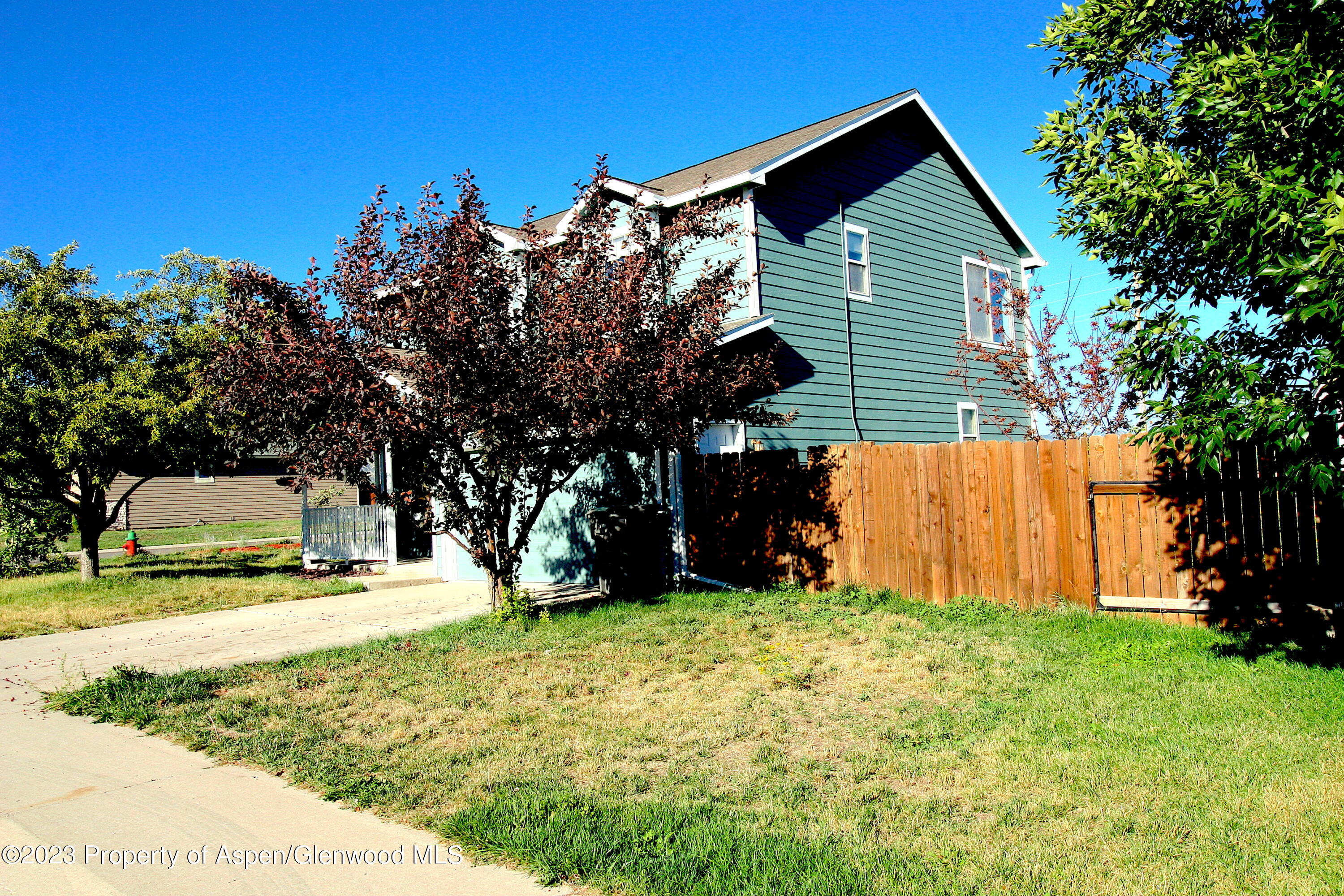 1391 East 17th Street Rifle, CO 81650 - Photo 8 of 36 a view of a house with backyard and trees