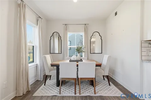 a view of a dining room with furniture and window
