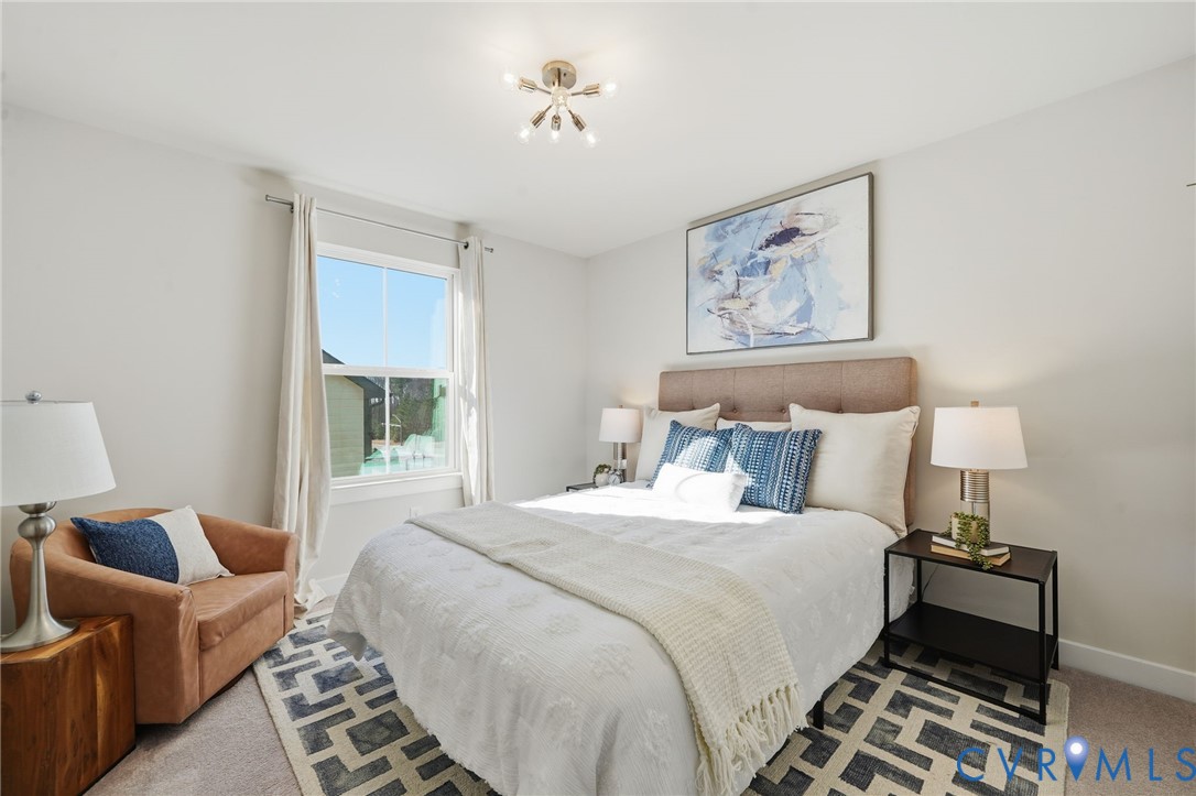 4730 Hepler Ridge Way Glen Allen, VA 23059 - Photo 16 of 39 a bedroom with bed and a couch