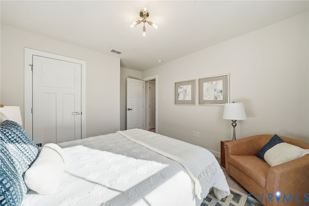 4730 Hepler Ridge Way Glen Allen, VA 23059 - Photo 17 of 39 a bedroom with a bed and a couch