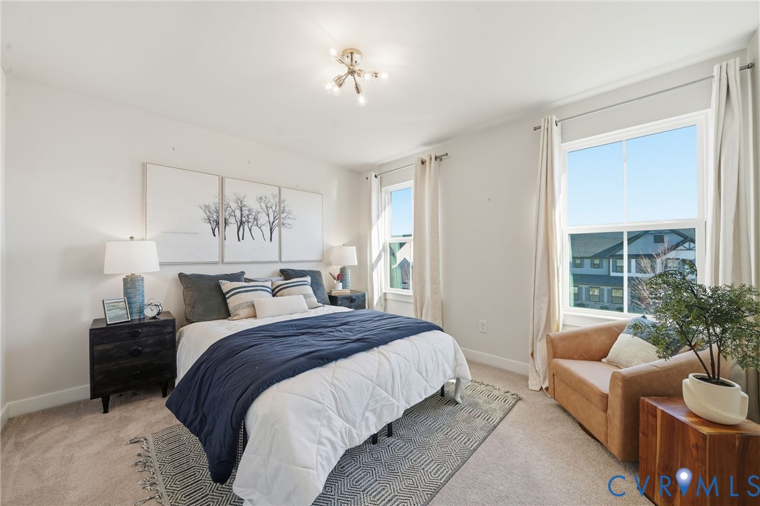 4730 Hepler Ridge Way Glen Allen, VA 23059 - Photo 20 of 39 a spacious bedroom with a bed and a couch