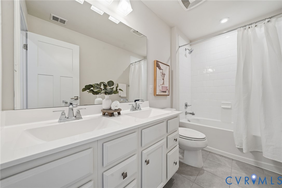 4730 Hepler Ridge Way Glen Allen, VA 23059 - Photo 25 of 39 a bathroom with a double vanity sink toilet mirror and bathtub