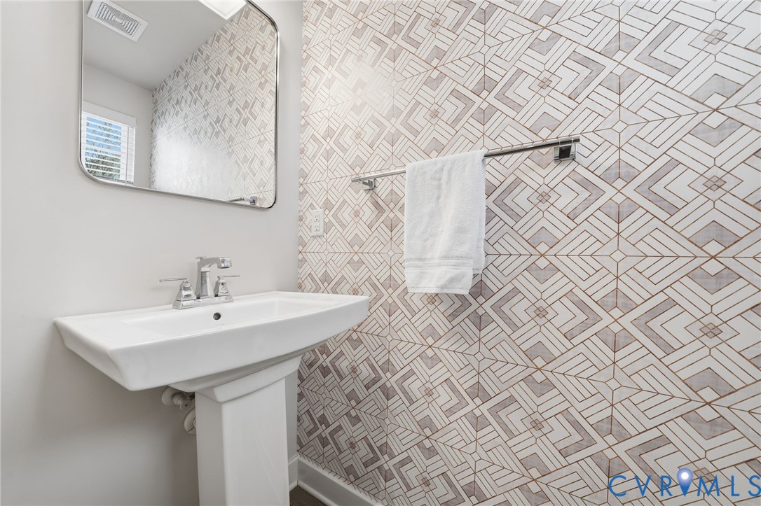 4730 Hepler Ridge Way Glen Allen, VA 23059 - Photo 28 of 39 a bathroom with a sink and a mirror