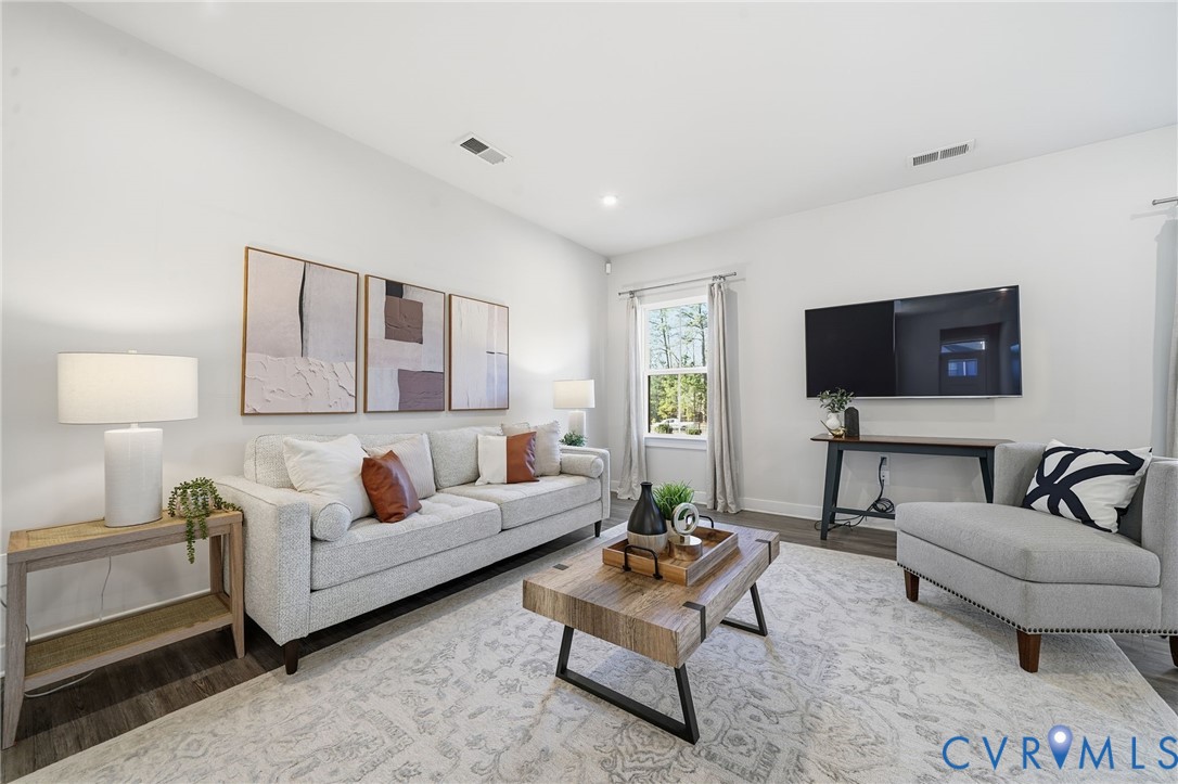 4730 Hepler Ridge Way Glen Allen, VA 23059 - Photo 3 of 39 a living room with furniture and a flat screen tv