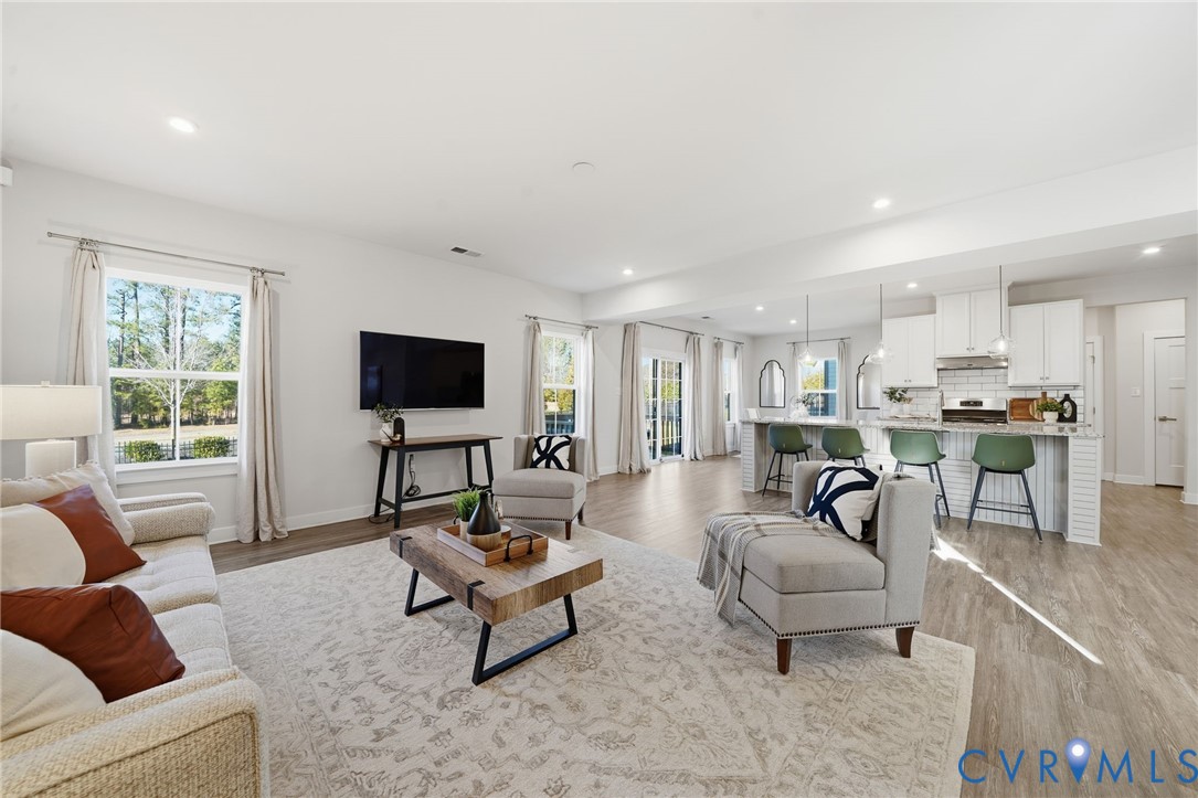 4730 Hepler Ridge Way Glen Allen, VA 23059 - Photo 4 of 39 a living room with furniture and a flat screen tv