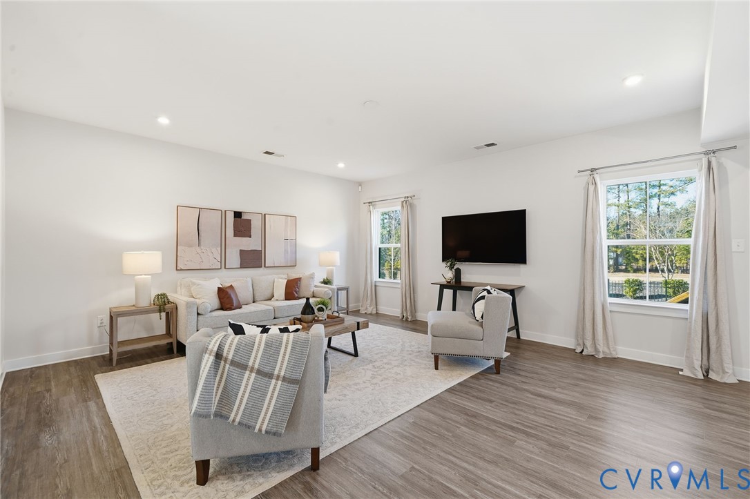 4730 Hepler Ridge Way Glen Allen, VA 23059 - Photo 6 of 39 a living room with furniture fireplace and a flat screen tv