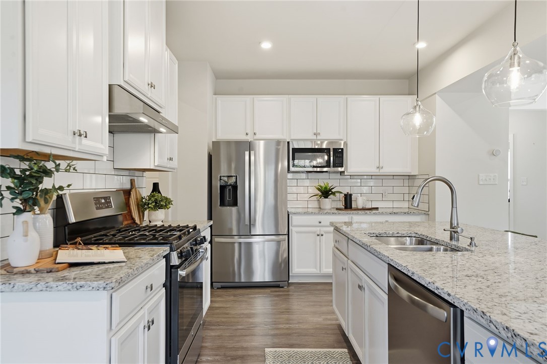4730 Hepler Ridge Way Glen Allen, VA 23059 - Photo 8 of 39 a kitchen with kitchen island granite countertop a sink stainless steel appliances and cabinets