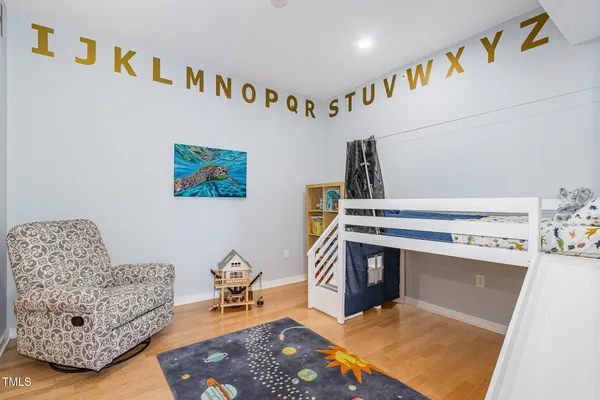 a bathroom with a bathtub shower sink mirror vanity and toilet