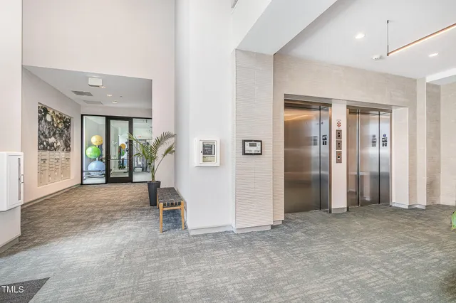 a view of a terrace with furniture and city view