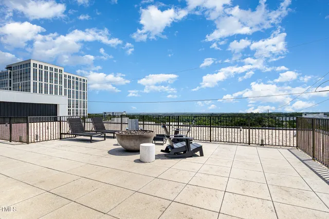 a balcony view with couple of chairs