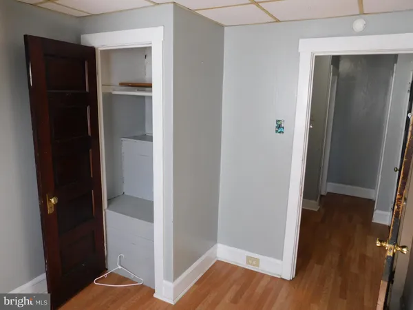 a view of hallway with wooden floor
