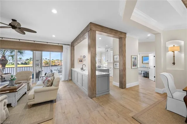a large white kitchen with stainless steel appliances