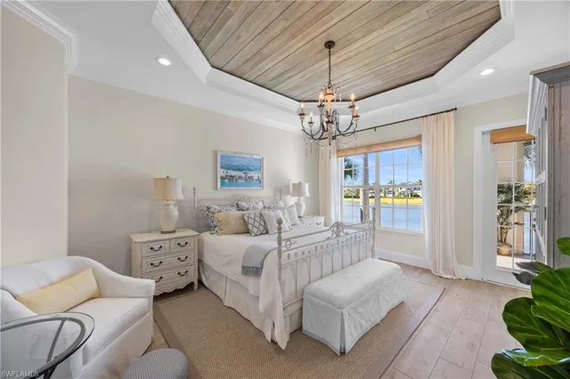 a spacious bathroom with a bathtub sink mirror and shower