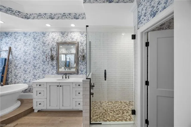 a bedroom with two beds and a chandelier