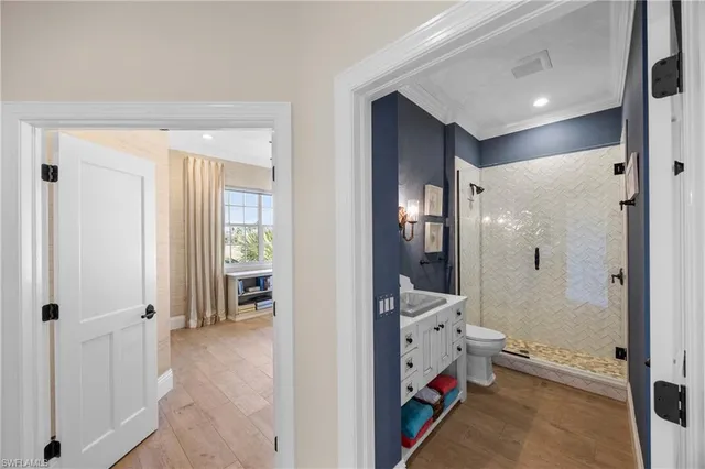 a living room with furniture and chandelier