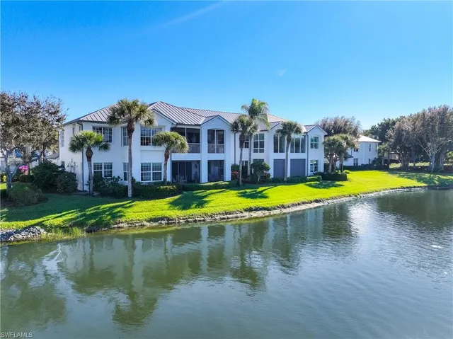 an aerial view of a house with garden space and street view